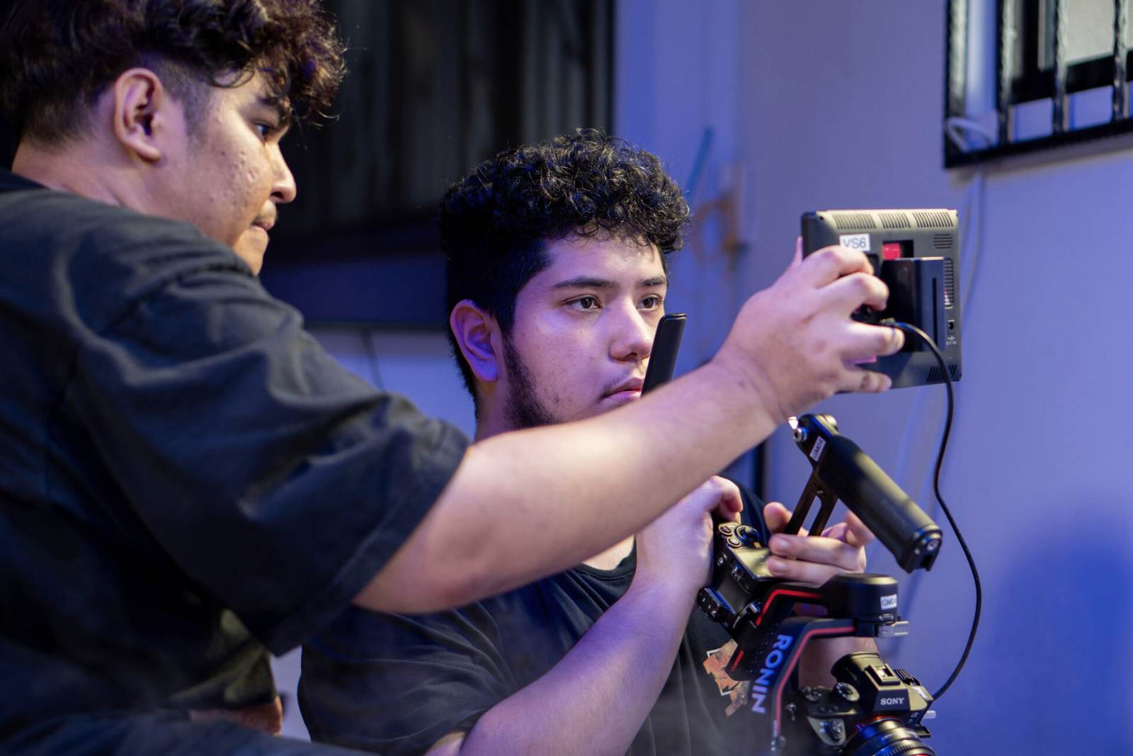 Crew reviewing a shot on the monitor during a music video shoot